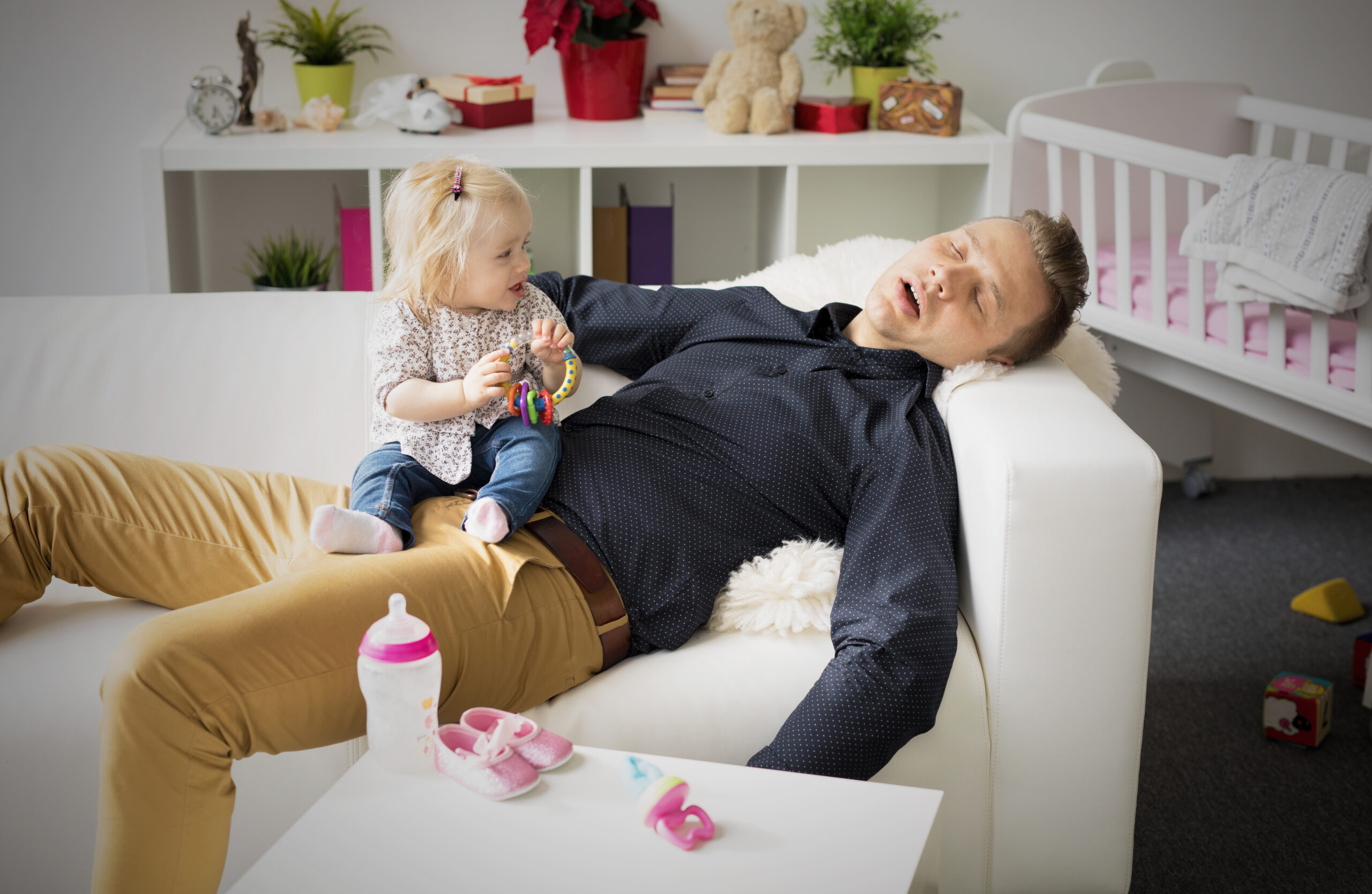 Tired,Father,Sleeping,With,Baby,On,His,Lap