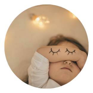 10 toddler laying down with arm over eyes - plume sleep consulting